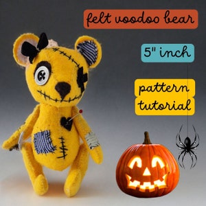 May include: A 5 inch yellow felt voodoo bear with black eyes, a button nose, and stitched details. The bear is sitting on a gray surface with a jack-o-lantern and a spider in the background. The text "felt voodoo bear", "5" inch", "pattern", and "tutorial" are visible in the image.