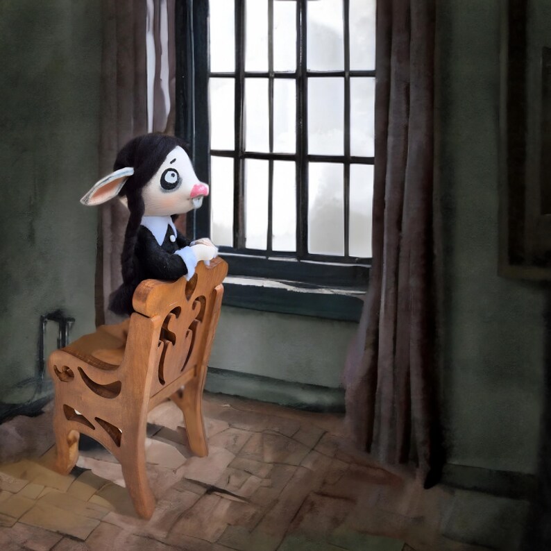 May include: A doll with pale skin, large dark eyes, and long black braided hair, wearing a black dress with a white collar and cuffs. The doll is positioned on a light brown wooden chair with decorative cutouts, facing a window with dark curtains.