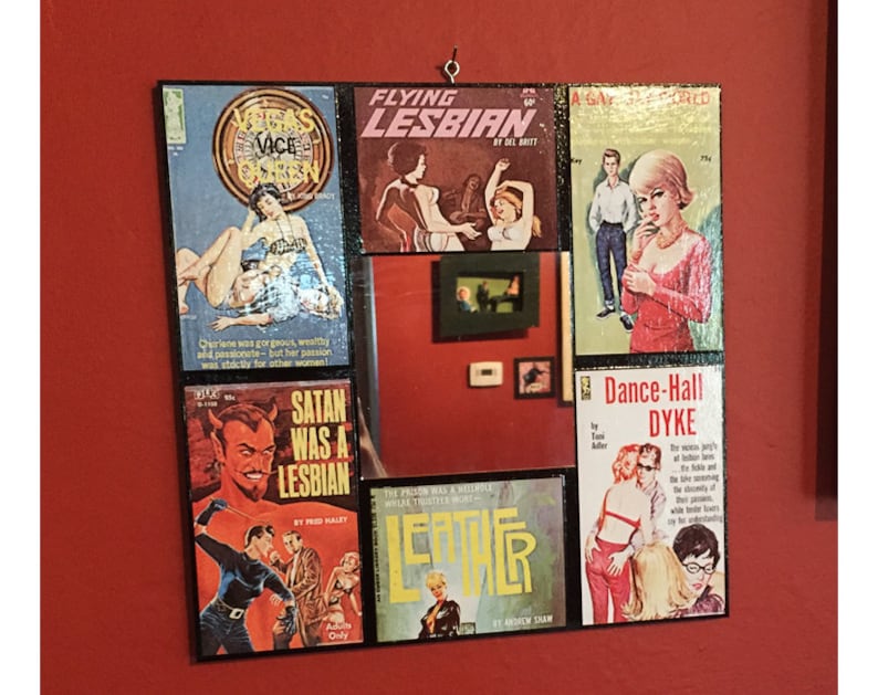 May include: A collage of vintage paperback book covers with titles like "Flying Lesbian", "Satan Was a Lesbian", "Dance-Hall Dyke", and "A Gay Bar in Morocco". The covers feature illustrations of women in various poses and settings.