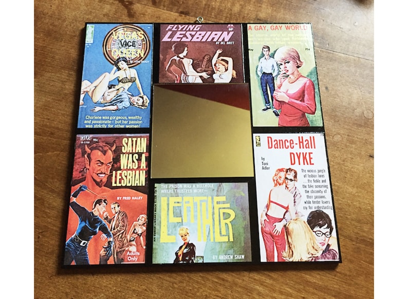 May include: A collage of vintage paperback book covers with titles like "Flying Lesbian", "Satan Was a Lesbian", "Dance-Hall Dyke", and "Leather". The covers feature illustrations of women and men in various poses.