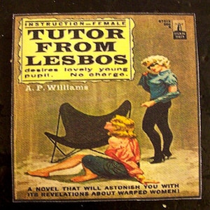 May include: A vintage book cover with a yellow background and the title "Tutor From Lesbos" in bold black letters. The cover features a woman in a blue shirt and black pants standing next to a woman sitting in a black chair. The text on the cover reads "A Novel That Will Astonish You With Its Revelations About Warped Women!"
