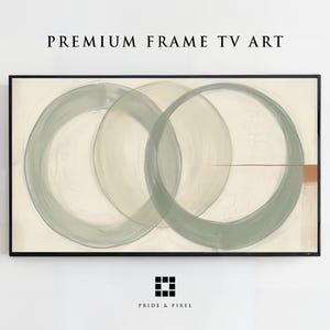 Könnte beinhalten: Ein rechteckiger digitaler Fernsehbildschirm mit abstrakter Kunst, bestehend aus drei überlappenden, salbeigrünen, kreisförmigen Pinselstrichen auf cremefarbenem Hintergrund. Rechts sind eine dünne horizontale Linie und ein kleines braunes Rechteck zu sehen. Text: PREMIUM FRAME TV ART.