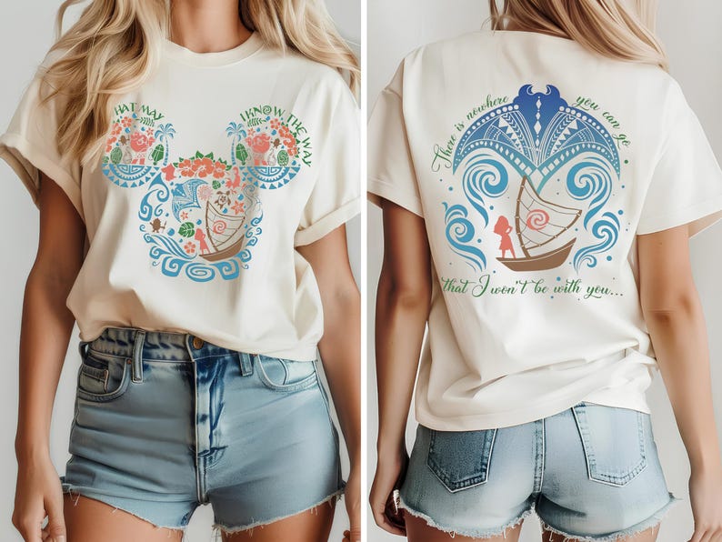 May include: Cream-colored t-shirt featuring a graphic design inspired by a Disney movie. The front displays a Mickey Mouse head shape filled with floral and nautical elements, with the text "HAT MAY" and "I KNOW THE WAY". The back has a boat design and the text "There is nowhere you can go that I won't be with you..."