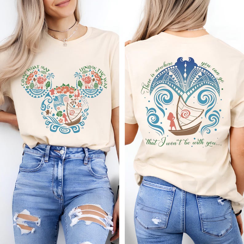 May include: Cream-colored t-shirt with a colorful graphic on the front and back. The front features a Mickey Mouse-shaped design with floral and boat motifs, and the text "COME WHAT MAY" and "I KNOW THE WAY". The back has a boat design and the text "There is nowhere you can go that I won't be with you..."
