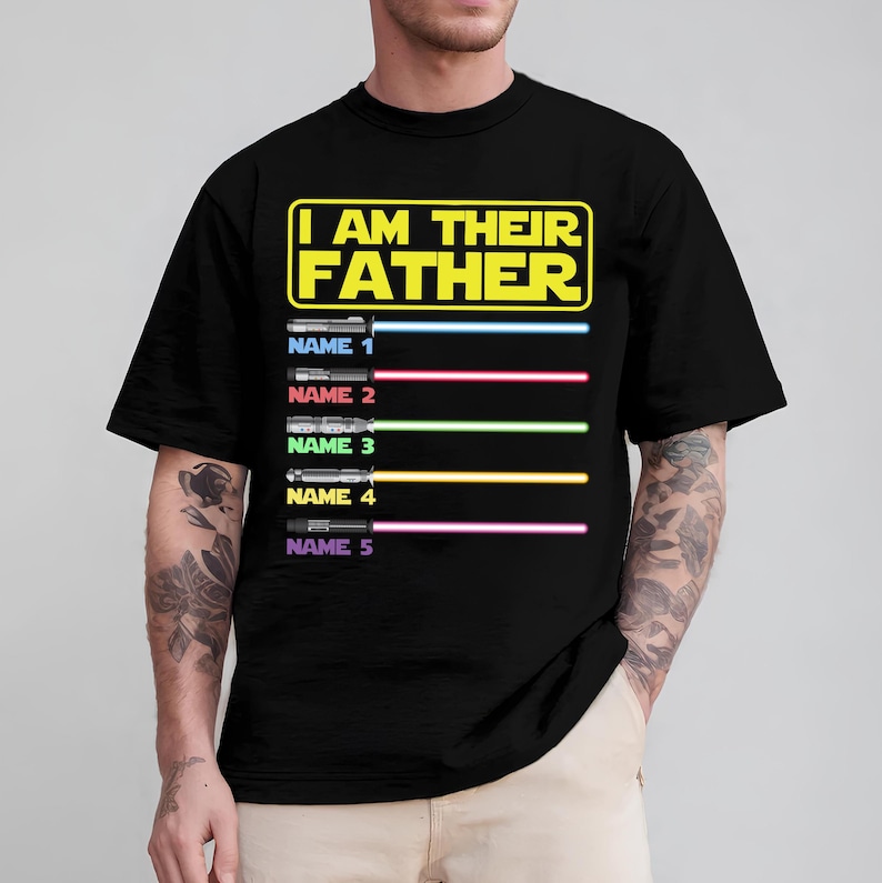 May include: Black t-shirt with the text "I AM THEIR FATHER" in yellow and white. Below the text are five light saber designs with the names 1 through 5. Each light saber has a different color.