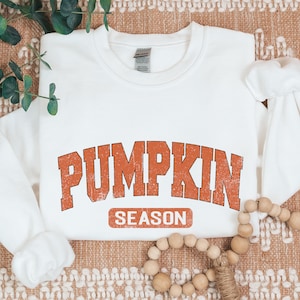 a white shirt with the words pumpkin season on it