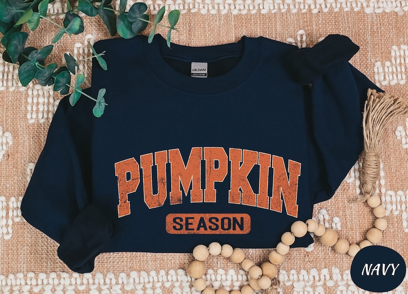 a blue shirt that says pumpkin season on it