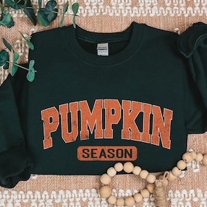 a green shirt with the words pumpkin season on it