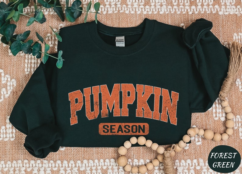 a green shirt with the words pumpkin season on it