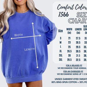 a woman wearing a blue sweatshirt with a size chart and measurements provided.