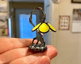 Miniature lamp with a vine and flower design. Lovely pewter colored vine, leaves, and flower base with a jade green colored shade.