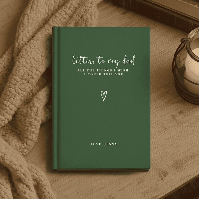 May include: A dark green hardcover journal with white text that reads Letters to my dad, ALL THE THINGS I WISH I COULD TELL YOU, a small hand-drawn heart icon, and the text LOVE, JENNA at the bottom of the front cover.