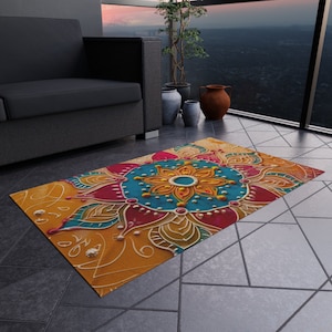 May include: A colorful mandala rug with a yellow, orange, red, blue, and green design. The rug has a floral pattern with a central flower.