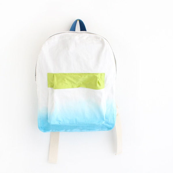 turquoise backpack with lime green pouch