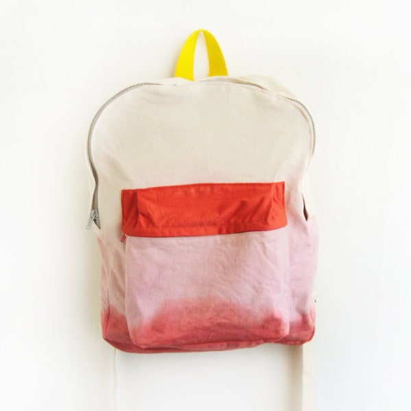 pink dyed backpack with orange pouch