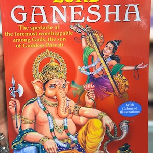 May include: A book cover with the title "LORD GANESHA" in large white letters on a red background. The cover features a colorful illustration of the Hindu deity Ganesha and other figures, with text that reads "The spectacle of the foremost worshippable among Gods, the son of Goddess Parvati."