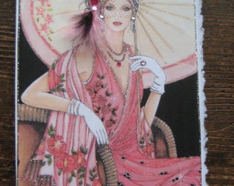 May include: A vintage-style illustration of a woman wearing a pink dress and a hat with a feather. She is holding a parasol and has a pearl necklace on. The image is on a white background with a silver glitter border.