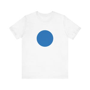May include: A white t-shirt with a large, solid blue circle in the center.