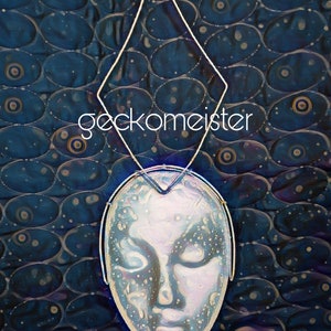 May include: Abstract digital art featuring a stylized face with closed eyes, overlaid with a diamond-shaped frame. The face is a light, translucent color, set against a dark blue background with an oval pattern. The word "geckomeister" is written in white.