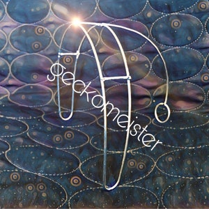 May include: A silver metal hoop with a curved design, resembling a stylized letter 'U'. The hoop is standing upright on a blue and purple patterned surface.