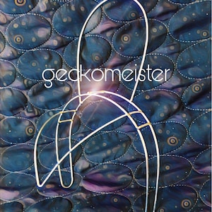 May include: A white metal wire frame with a rounded top and a curved base. The frame is sitting on a blue and purple quilted fabric with a pattern of circles.