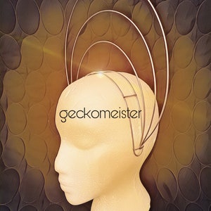 May include: A silver wire headpiece with multiple concentric circles, worn on a white mannequin head. The headpiece is on a brown background with a circular pattern.