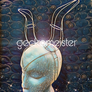 May include: A silver wire headpiece with two curved horns. The headpiece is on a white mannequin head against a blue and gold background.