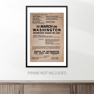May include: A vintage poster with a tan background and black text. The poster is an appeal to march on Washington for jobs and freedom on August 28, 1963. The poster lists the names of several civil rights leaders, including Martin Luther King Jr., James Farmer, Roy Wilkins, and John Lewis.