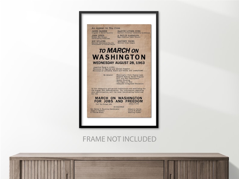 May include: A vintage poster with a tan background and black text. The poster is an appeal to march on Washington for jobs and freedom on August 28, 1963. The poster lists the names of several civil rights leaders, including Martin Luther King Jr., James Farmer, Roy Wilkins, and John Lewis.