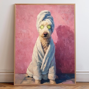 May include: A framed painting depicts a dog in a spa setting. The dog, with light-colored fur, wears a white towel on its head and a white robe. Cucumber slices cover its eyes. The background is a textured pink wall.