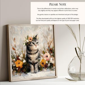 Puede incluir: Una impresi&oacute;n art&iacute;stica enmarcada que presenta un gato atigrado con una corona floral, rodeado de flores coloridas. La obra de arte tiene un estilo suave y pict&oacute;rico con un fondo neutro. El texto "PLEASE NOTE" es visible en la esquina superior derecha.