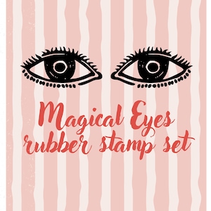 May include: A rubber stamp set featuring a pair of stylized black eyes with long lashes. The text "Magical Eyes rubber stamp set" is written in red script on a pink and white striped background.