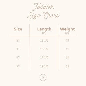 May include: A beige toddler size chart with the text "Toddler Size Chart" at the top. The chart lists sizes 2T, 3T, 4T, and 5T, with corresponding lengths in inches and weights in inches.