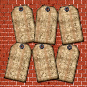 May include: Six rectangular gift tags with a plaid pattern in shades of brown and beige, each with a metal grommet. The tags are arranged against a red brick wall background.