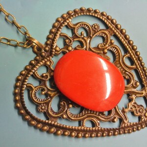 Pendant necklace with genuine tested vintage 1950s flamy swirled deep red tested bakelite plastic cabochon and antiquecolor bronze heart