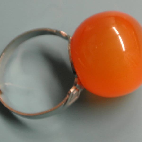 Adjustable silvercolor metal  ring with genuine vintage 1950s light orange moonglow plastic ball bead