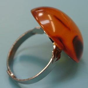 Adjustable silvercolor metal ring with genuine tested vintage 1950s flamy swirled halftranslucent light brown bakelite plastic bead