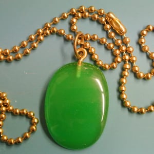 Pendant necklace with genuine tested vintage 1950s halftranslucent grass green bakelite plastic bead and brass ball chain