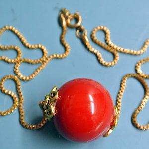 Goldcolor brass chain necklace with large deep red color genuine tested vintage 1940s bakelite plastic bead and brass beadcaps