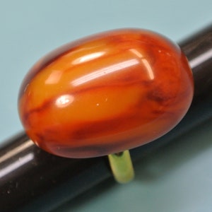Adjustable goldcolor metal ring with genuine tested vintage 1950s oval flamy swirled opaque butterschotch yellow/brown bakelite plastic bead