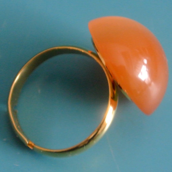 Adjustable goldcolor metal  ring with genuine vintage 1950s light orange moonglow plastic cabochon bead