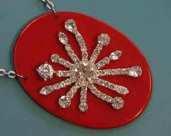 Unique one-of-a-kind large sparkling rhinestone and red plastic star motive pendant with chain necklace