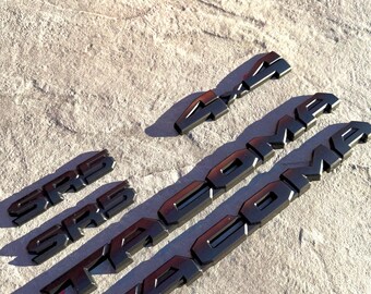 thumbnail image 2 of Matte Black Overlay Emblem Badge Set For 2024-2025 Toyota Tacoma SR5 – 5 Pieces 2 of 5