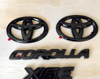2020-2025 Toyota Corolla XSE Gloss Black Emblem Overlay Set (4PCS) | PT948-02202-02 | OEM