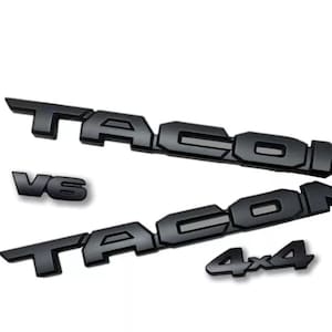 Zestaw nakładek na czarny emblemat Toyota Tacoma 2016-2023. PT948-34181-02