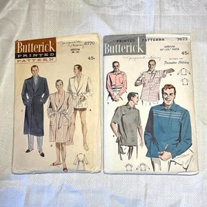 May include: Two vintage Butterick printed sewing patterns. One pattern is for a robe and the other is for shirts. The patterns feature illustrations of the finished garments and include the text "Butterick Printed Pattern".