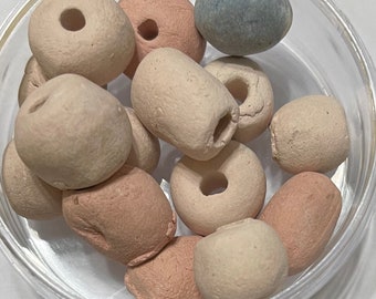 Large handmade clay beads there are 15 beads and they are about 1/2 inch in diameter each.