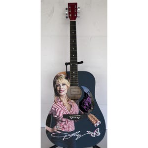Dolly Parton full size acoustic guitar (one of a kind ) signed with proof 