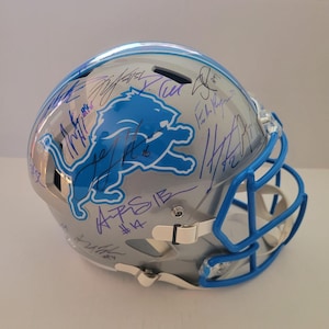 Detroit Lions Riddell authentic pro game model helmet signed by 40 members of the 2024 team with signing proof