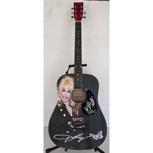 Dolly Parton (one of a kind ) full size acoustic guitar signed with proof 